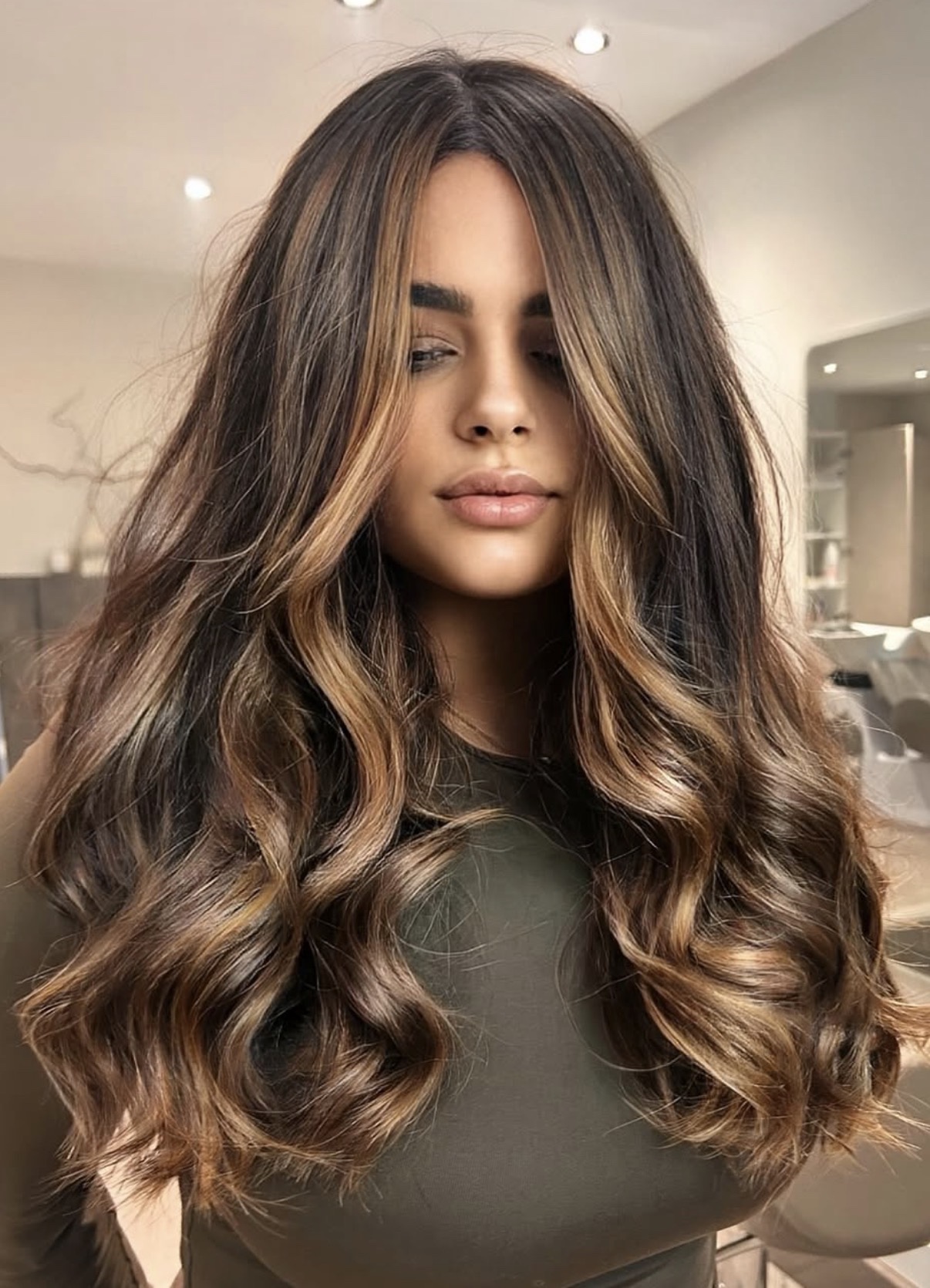 Dimensional brunette colour with bright face framing ribbons